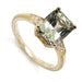 Radiant cut light green sapphire engagement ring in 14kt yellow gold with lab diamond accents