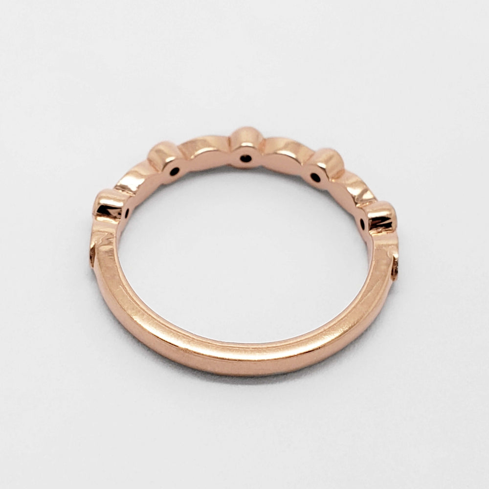 Rear view of 14k rose gold wedding ring with leaf and diamond details
