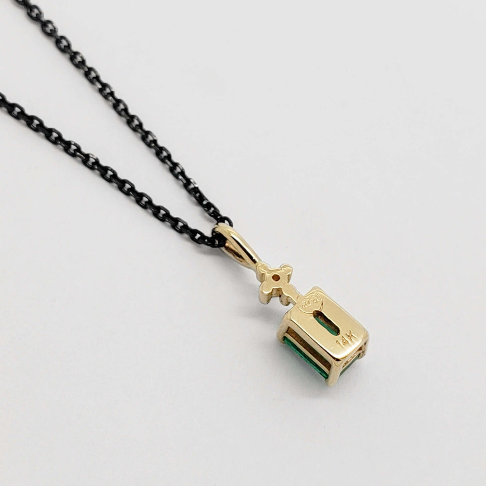 Back view of 14kt yellow gold emerald and diamond pendant showing 14k stamp