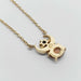 Back view of 10kt yellow gold crowned moon necklace showing gemstone settings