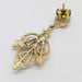 Back view of a vintage 14kt yellow gold opal twig earring showing detailed goldwork