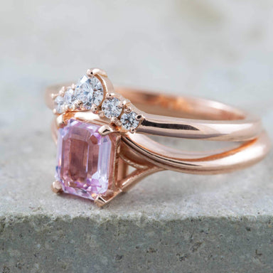 Rose gold chevron diamond wedding ring stacked with a pink emerald-cut gemstone ring