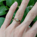 Rose gold diamond wedding band stacked with ruby and diamond ring on hand