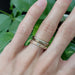 Rose gold engraved wedding ring with lab diamond stacked with yellow gold diamond band, on hand
