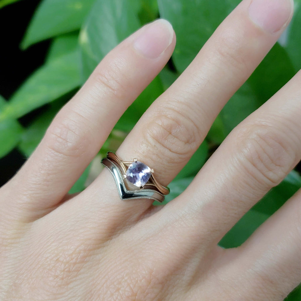 Rose gold pink sapphire ring stacked with milgrain chevron band on hand