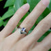 Rose gold pink sapphire ring stacked with milgrain chevron band on hand