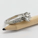 Side view of white gold engagement ring with moissanite and pave-set Canadian diamonds