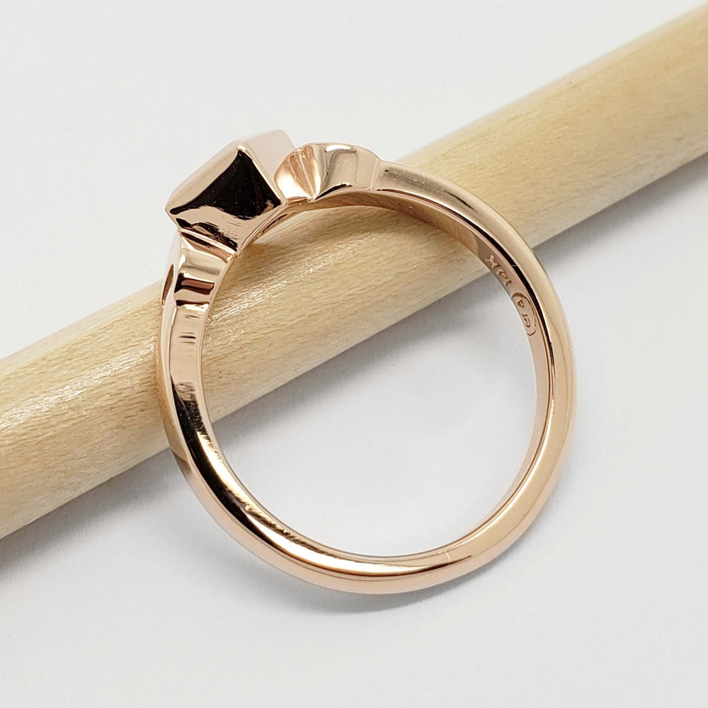 Side view of 14kt rose gold ring with crescent moon details, no gemstone visible