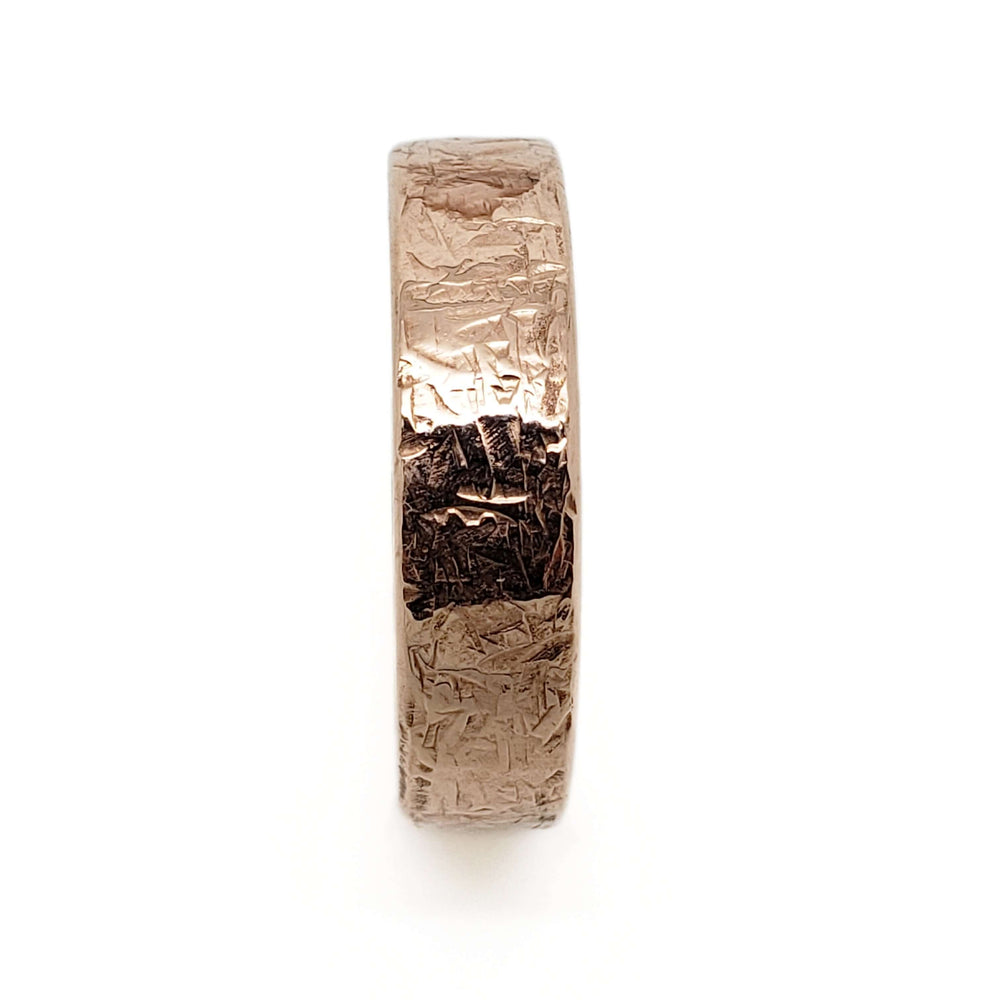 Side view of 14kt rose gold wedding band with elephant skin texture, handcrafted