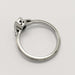 Side profile of 14kt white gold ring with milgrain detail and openwork under the setting