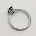 Side profile of 14kt white gold ring with milgrain detail and sapphire setting