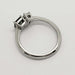 Side profile of 14kt white gold ring with teal sapphire and pear lab diamond settings