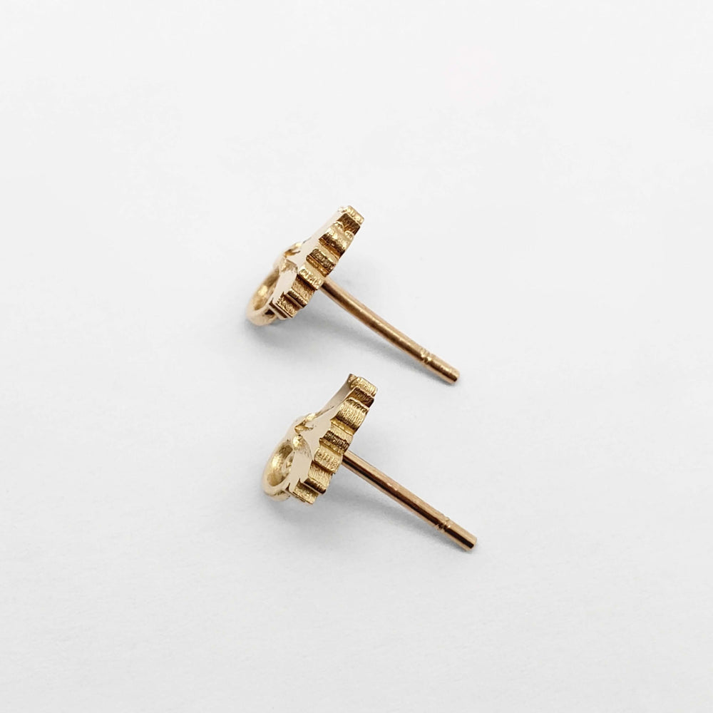 Side view of 14kt yellow gold carnation floral stud earrings showing earring posts