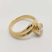 Side profile of 14kt yellow gold curvy ring with bezel-set round lab diamond