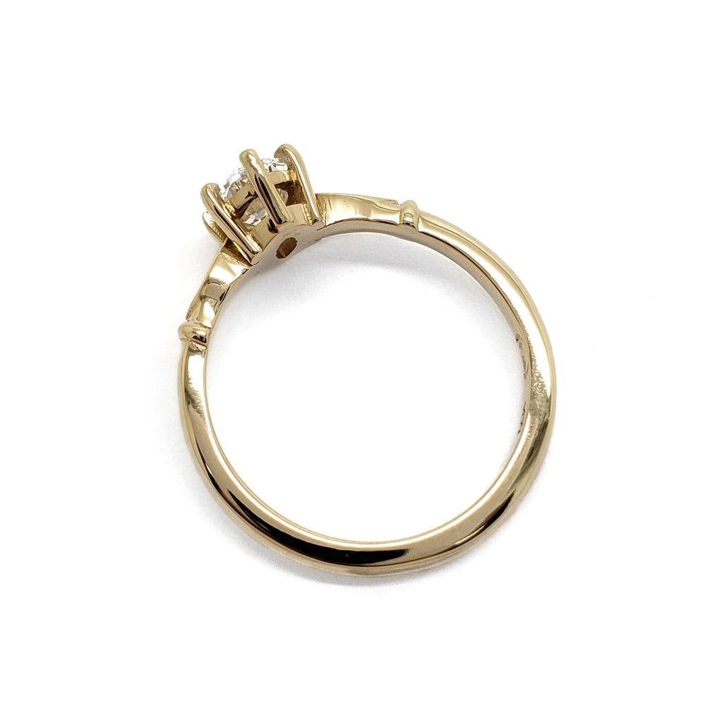 Side profile of 14kt yellow gold engagement ring with oval lab diamond