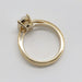 Side profile of 14kt yellow gold engagement ring with oval lab diamond and millgrain edge
