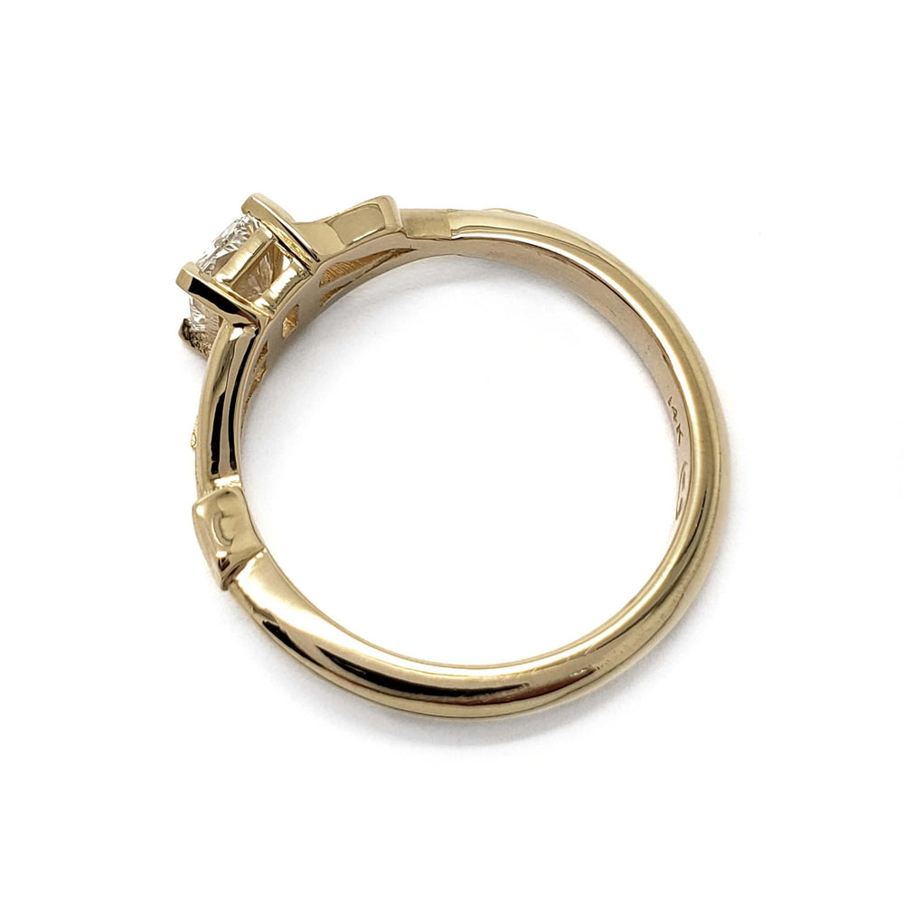 Side profile of 14kt yellow gold engagement ring with radiant lab diamond