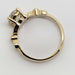 Side profile of 14kt yellow gold engagement ring with raised lab-grown diamond setting