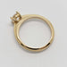 Side profile of 14kt yellow gold ring with four-claw lab diamond setting