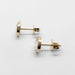 Side view of 14kt yellow gold moissanite stud earrings showing bezel setting