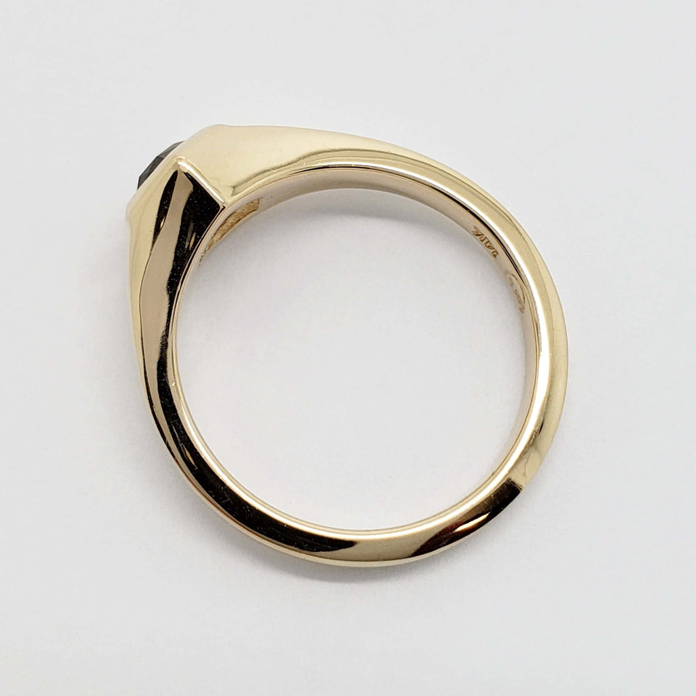 Side profile of 14kt yellow gold ring with hexagon Montana sapphire