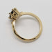 Side profile of 14kt yellow gold ring with marquise green sapphire and lab diamonds