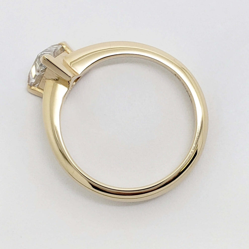 Side view of 14kt yellow gold ring with triangle cut lab-grown diamond