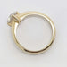 Side view of 14kt yellow gold ring with triangle cut lab-grown diamond