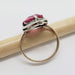 Side view of 9kt gold and silver ring with pink synthetic sapphire and marcasite setting