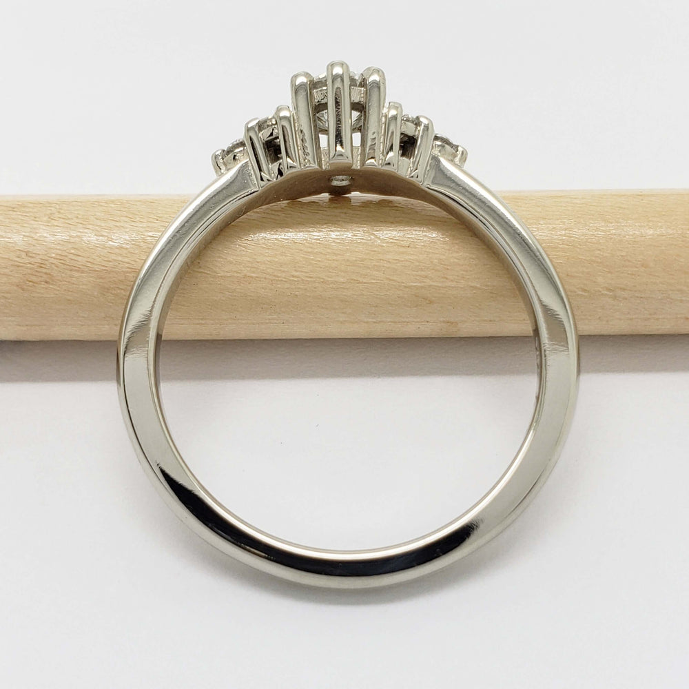 Side view of Petite Zira 14kt white gold lab diamond ring showing setting detail