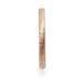 Side profile of a 14kt rose gold wedding ring with saw blade texture