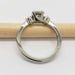 Side profile of a 14kt white gold engagement ring with antique diamond setting