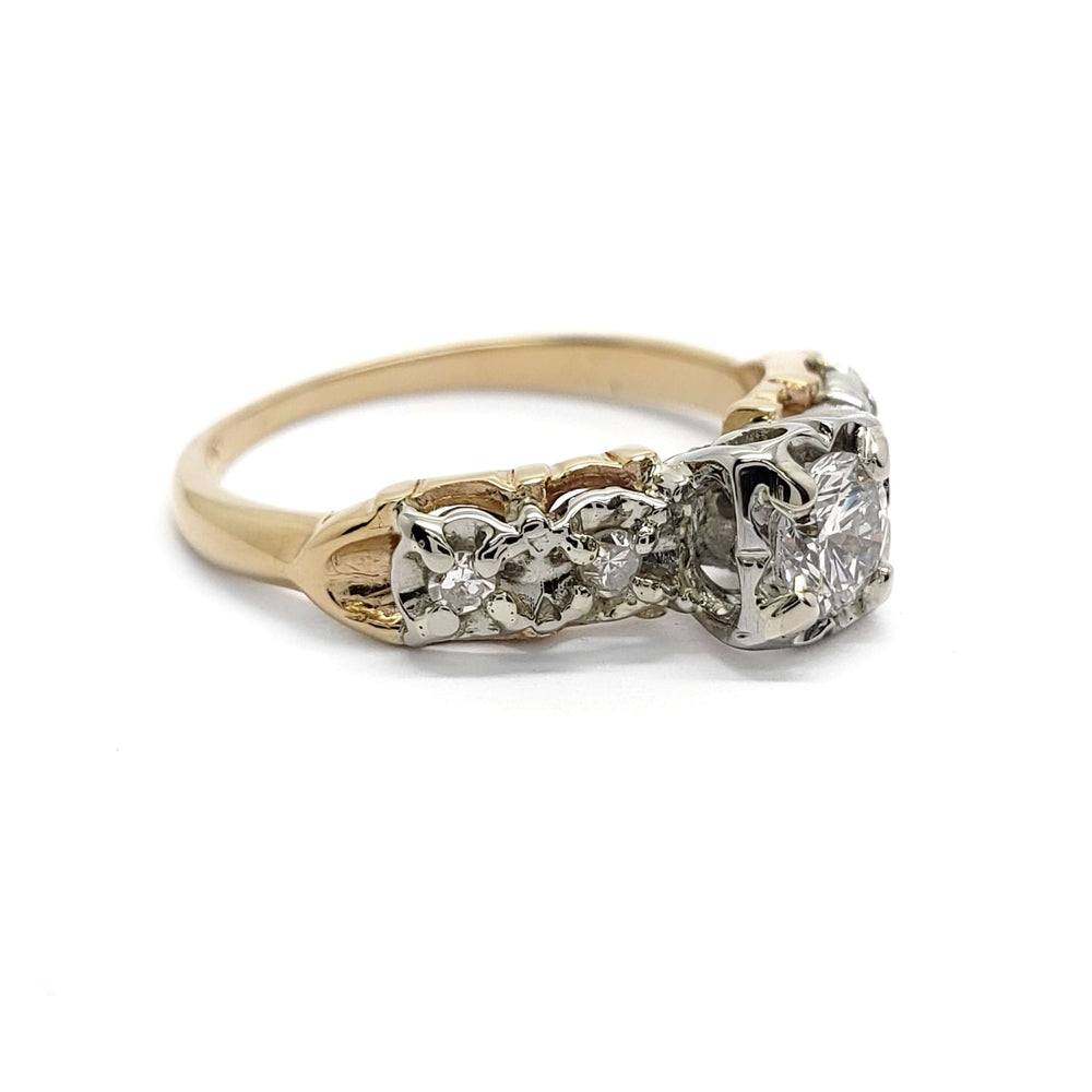 Side profile of antique five stone diamond ring in 14kt yellow and 18kt white gold