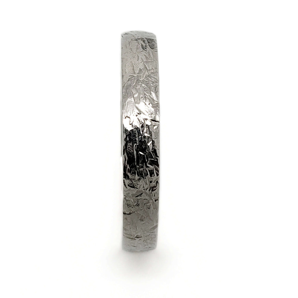 Side profile of domed 14kt white gold wedding band with elephant skin texture
