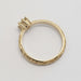 Side profile of engraved 14k yellow gold ring with antique diamond setting