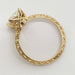 Profile of engraved 14kt yellow gold ring with cushion cut lab diamond setting