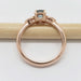Side view of rose gold Montana sapphire engagement ring showing setting details