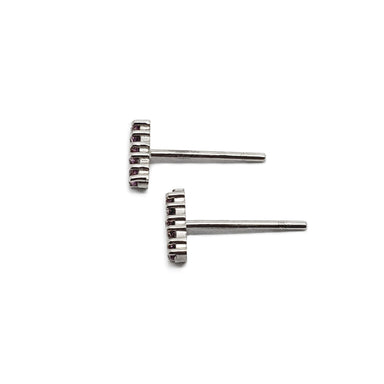 Side view of 14kt white gold bar stud earrings with prong-set sapphires