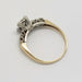 Side profile of two-tone 14kt gold antique diamond ring with illusion setting