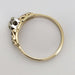 Side profile of two-tone gold antique diamond ring with openwork gallery