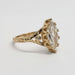Side profile of vintage-inspired 14kt yellow gold ring with marquise lab diamond