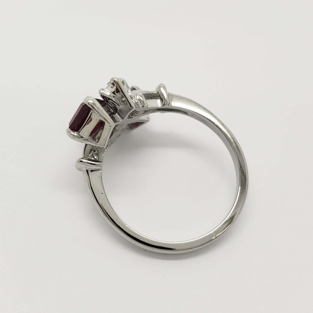 Side profile of vintage 10kt white gold cocktail ring with red glass and cubic zirconia