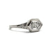 Side view of white gold engagement ring with hexagon lab diamond and pave accents