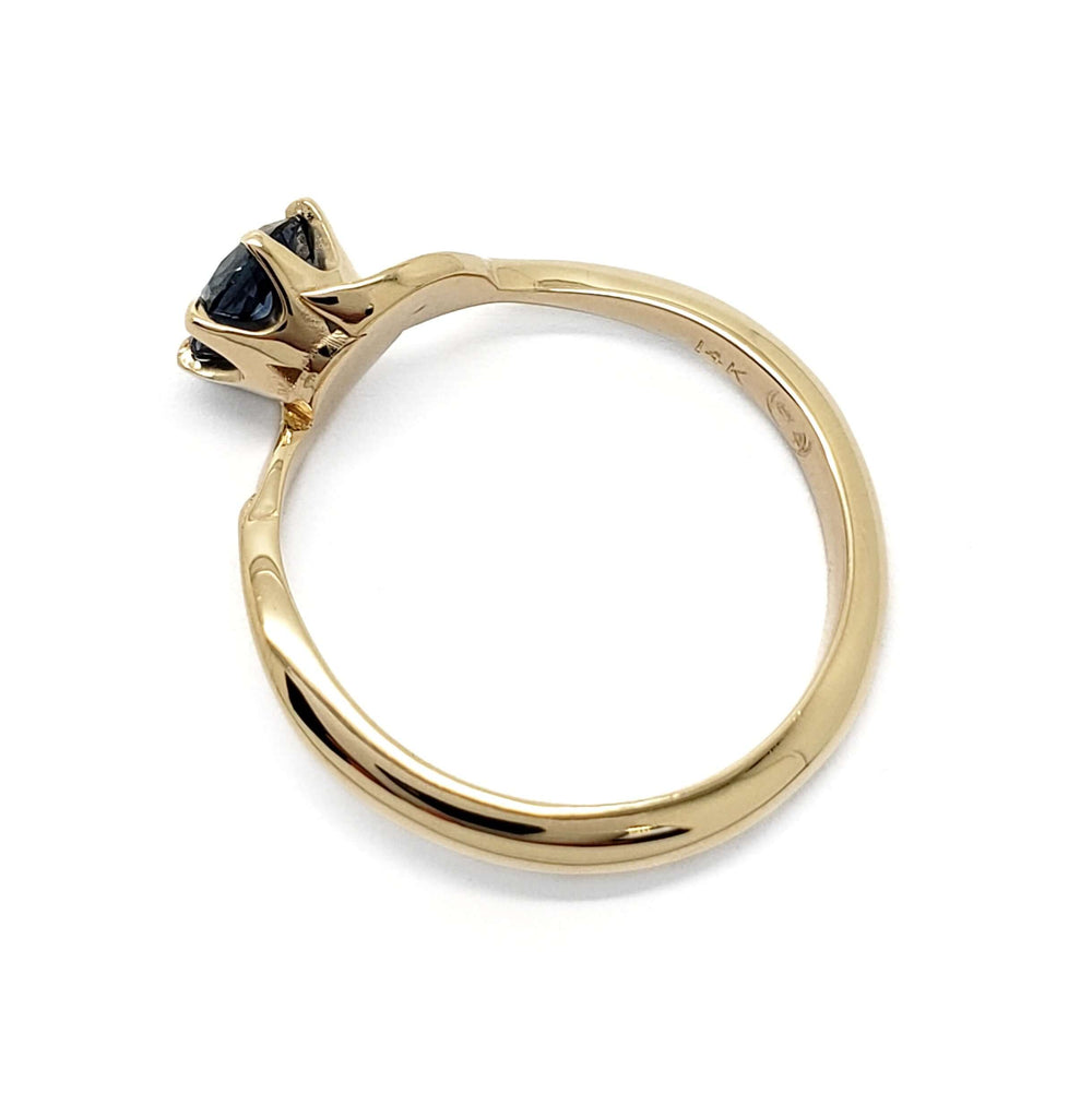 Side profile of yellow gold Montana sapphire ring showing six-claw setting