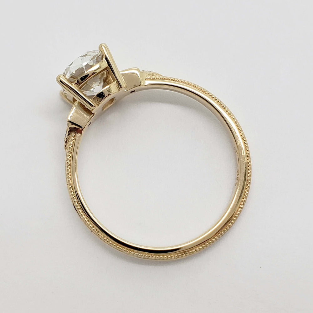 Side profile of yellow gold engagement ring with old mine cut lab diamond
