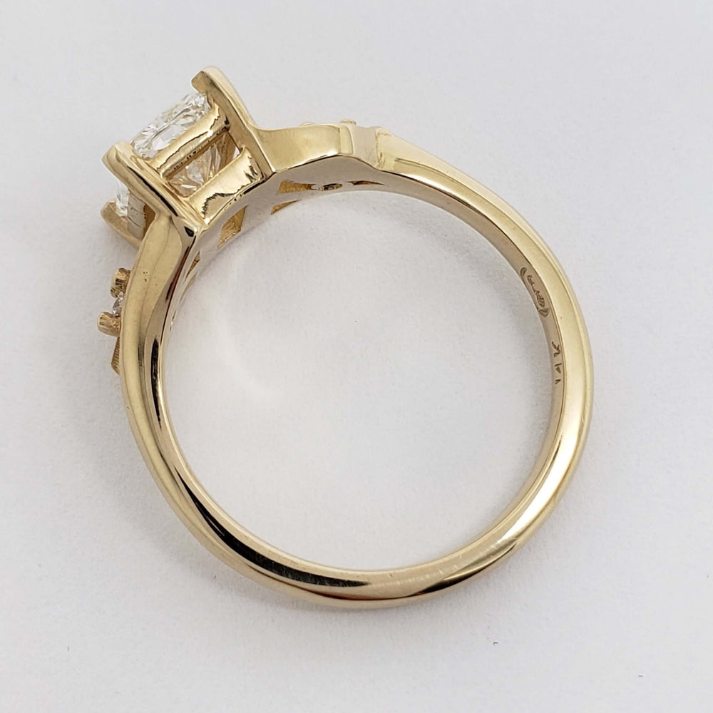 Side profile of yellow gold engagement ring with radiant cut lab diamond