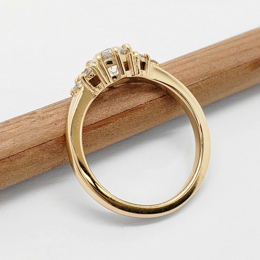 Side view of 14kt yellow gold lab diamond engagement ring showing claw setting and polished band