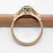 Side profile of yellow gold ring showing under-gallery cutouts and millgrain details