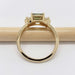 Side view of 14kt yellow gold ring with Australian sapphire and lab diamonds on a pencil