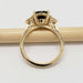 Side profile of yellow gold ring with Australian sapphire and lab diamonds on a pencil